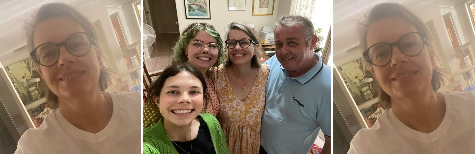 A group selfie of four people smiling together in a home setting, with bright lighting and a cozy background.