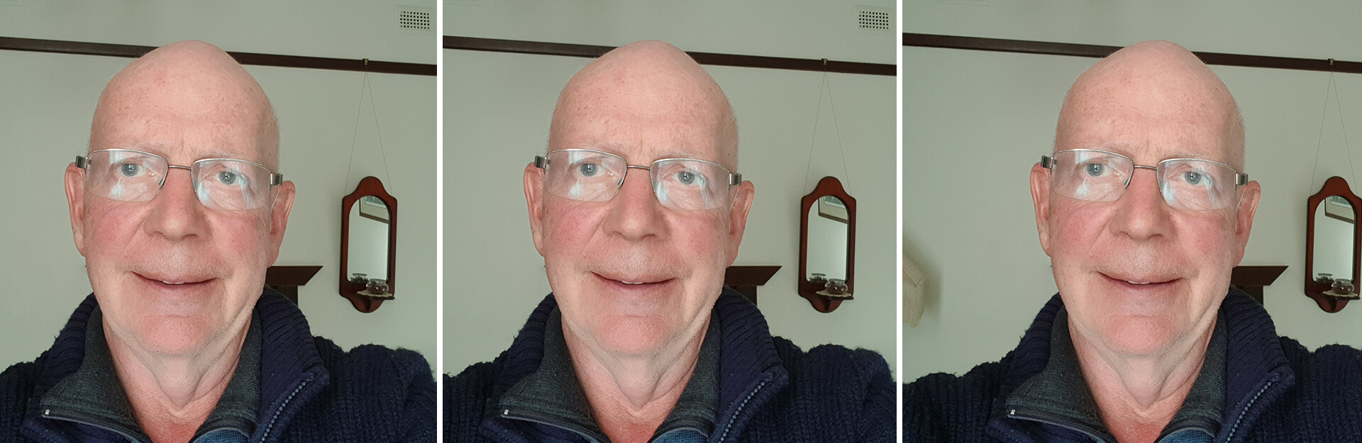 A smiling bald man wearing glasses, in three similar selfies with a plain background and a mirror behind him.