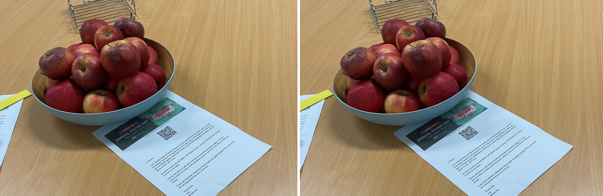 A bowl of red apples on a wooden table, alongside informational papers and a yellow bookmark.