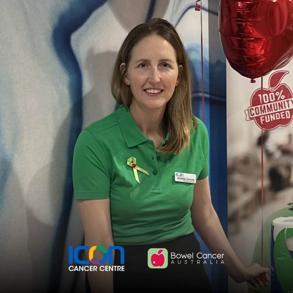 A woman in a green polo shirt smiles, wearing a yellow ribbon, with logos for Icon Cancer Centre and Bowel Cancer Australia visible.